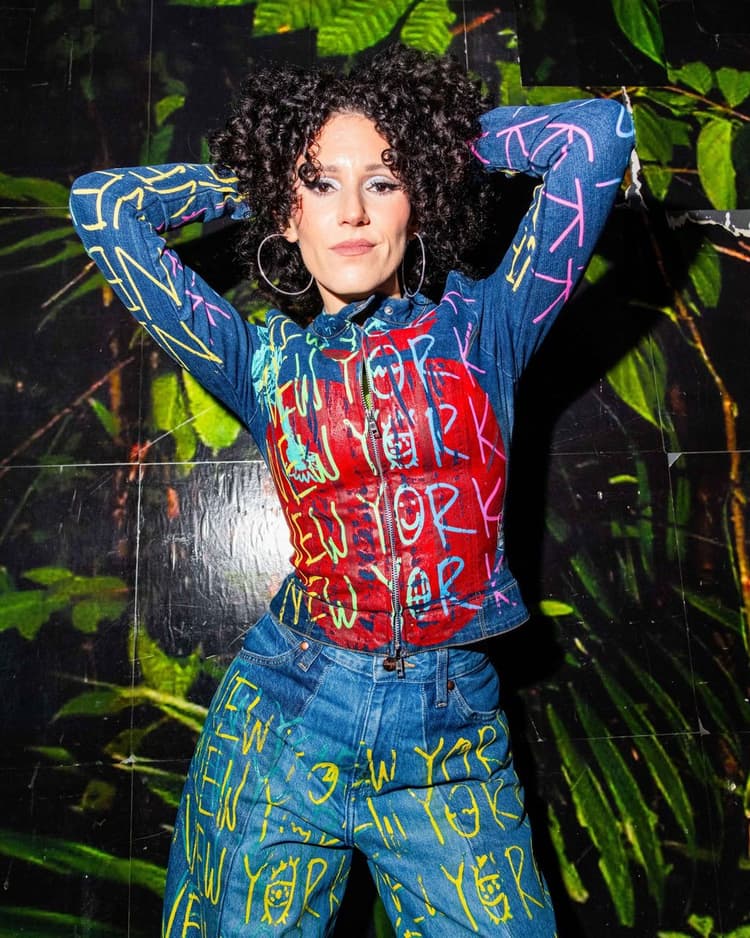 Ali in the graffiti New York jacket against a jungle wall, Nublu shoot